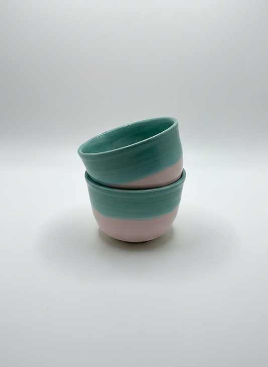 Two ceramic bowls stacked on a white background